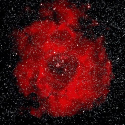 Black background with stars dotting it, in the center is a completely red nebula